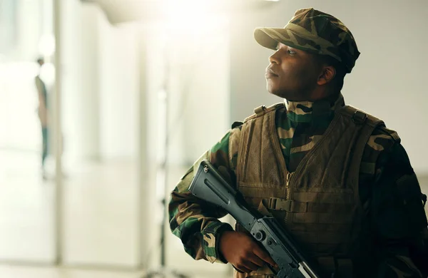 Thinking, soldier and black man with gun in army, vision and serious in security. Military veteran, rifle and weapon of African professional with idea in camouflage uniform at government agency