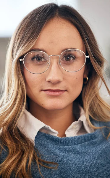Face, business woman and designer in glasses at startup company, office and workplace. Portrait, creative professional and confident female entrepreneur, worker and employee in Australia for career