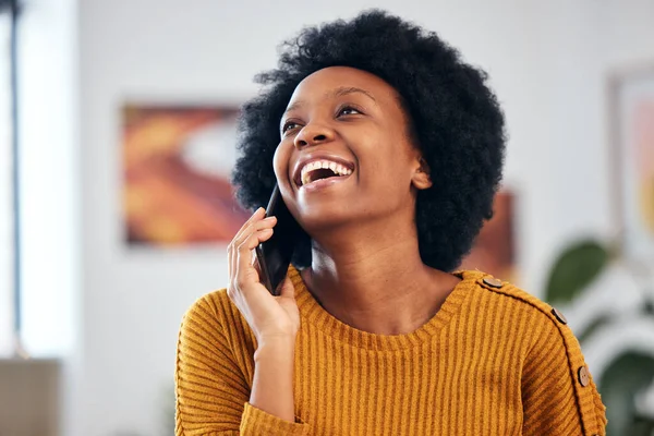 Funny black woman in phone call, talking and conversation with contact at home. African person laughing on smartphone, listening to comedy and news in discussion of meme, communication and excited.