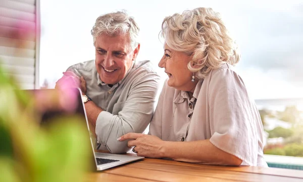 Happy, email and senior couple with a laptop for communication, home budget or ecommerce. Online banking, love and an elderly man and woman with a computer for planning retirement or working on tech.