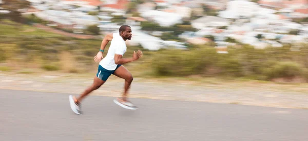 Speed, road and a black man running for fitness, exercise and training for a marathon. Sports, health and an African runner or fast person in the street for a workout, cardio or athlete commitment.