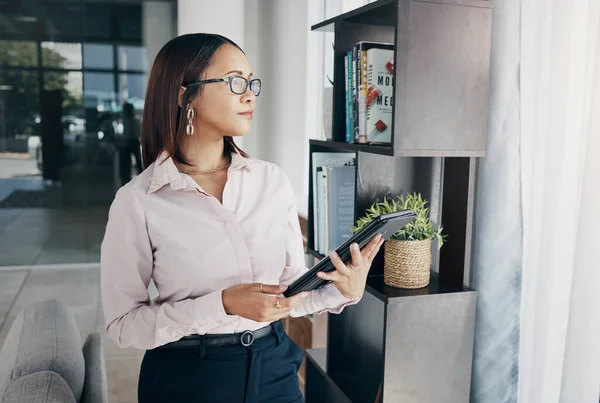 Businesswoman in office with glasses, tablet and thinking of email, schedule and online HR report feedback. Internet website, networking and ideas on digital app, woman at human resources agency