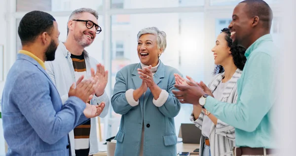 Creative people, meeting and applause in celebration for winning, team achievement or unity at the business office. Group of happy employees clapping in success for teamwork, promotion or startup at .