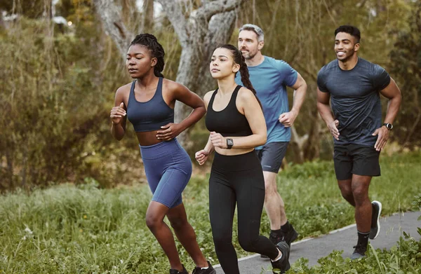 Runner group, men and women in park, training and outdoor exercise for health, sport or performance. Teamwork, running and workout for fitness, wellness and diversity in summer, freedom or nature.