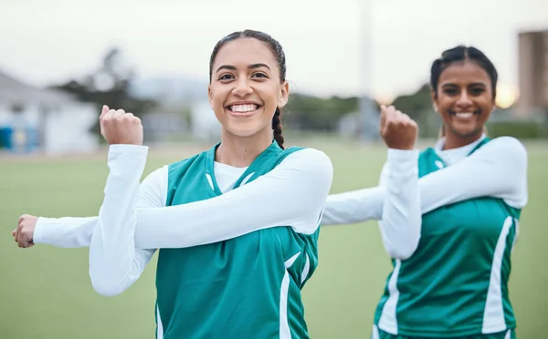 Sports, team and portrait of stretching arms on field with women in soccer or exercise with happiness outdoor. Football player, woman and training with a smile on face for fitness practice or match.