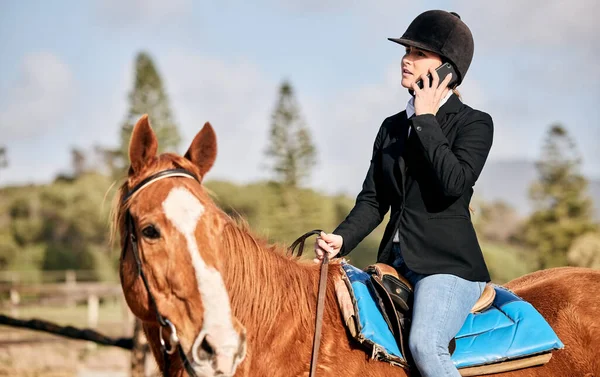 Horse, phone call and woman in the countryside with sport, equestrian and communication. Animal, farm and talking with female athlete and mobile conversation outdoor with pet and discussion in field.