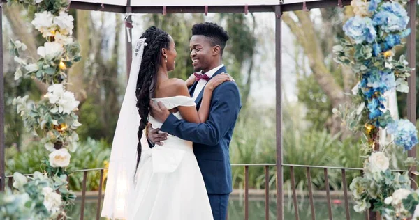 Wedding, first dance and black couple in garden with love, celebration and excited for future together. Gazebo, man and woman at marriage reception with flowers, music and happiness at outdoor party