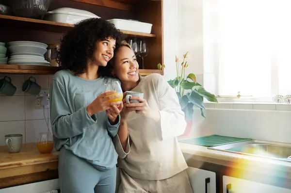 Lgbt couple, coffee and kitchen with smile for connection, romantic or relationship happiness. Lesbian woman partner, apartment and freedom hug for equality conversation, together or diversity pride.