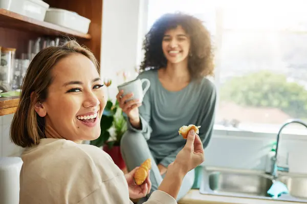Happy, portrait and a lesbian couple with breakfast in the kitchen for eating, hungry and coffee. Smile, house and gay or lgbt women with food, drink and laughing together for lunch in the morning.
