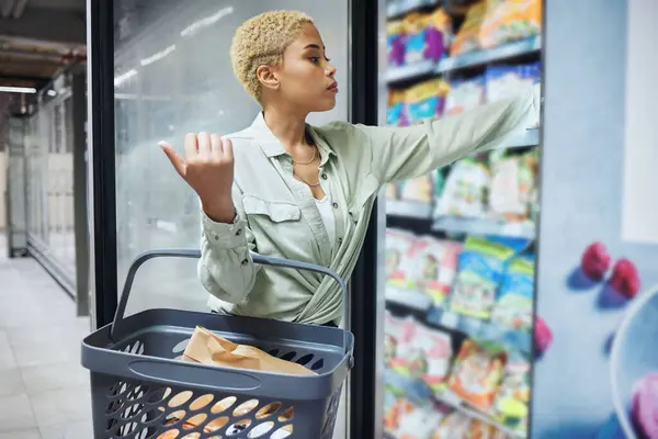 Fridge, grocery shopping or woman by shelf for food choice, product price check or retail cost. Sale offer, supermarket discount or biracial girl customer in convenience store for commerce or search.