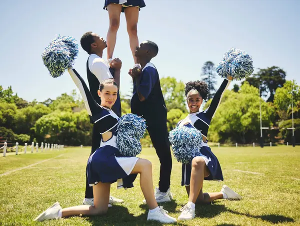 Cheerleader team, portrait and people in formation, dance and performance on field outdoor for exercise, training or workout. Happy cheerleading group at event, sport competition and game for support.