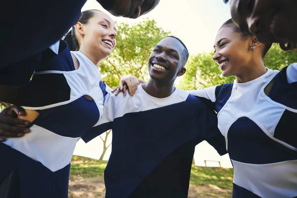 Cheerleader, happy or people in huddle for motivation with support, hope or faith in game on field. Teamwork, sports or group of excited athletes cheerleaders with pride, plan or solidarity together.