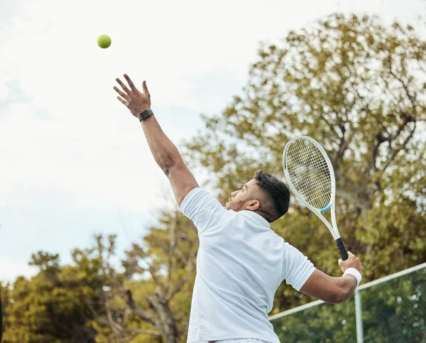 Man, tennis and serve with fitness on court and start game, sports and athlete, performance and competition. Health, energy and professional player on outdoor turf, exercise and racket during match.