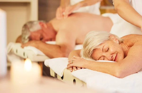 Beauty, back massage and senior couple at a spa for luxury, self care and muscle healing treatment. Health, wellness and elderly man and woman on retirement retreat for body therapy at natural salon