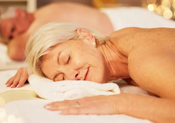 Health, back massage and senior couple at a spa for luxury, self care and muscle healing treatment. Relax, wellness and elderly man and woman on a retirement retreat for body therapy at natural salon.