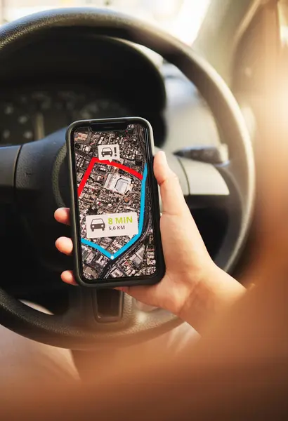 Phone, map and hands of person in a car for location, search or navigation closeup. Smartphone, travel and driver check app for online traffic notification, direction or road trip route in a vehicle.