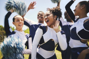 Cheerleaders, outdoor and team for celebration, smile and winner with happiness, excited and teamwork. Women, men and group cheering, grass field or chanting for champion, support and motivation. clipart