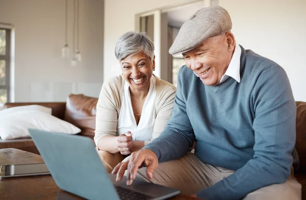 Senior couple, laptop and home living room with reading, smile or excited for streaming movie on sofa. Elderly woman, old man and computer with scroll, click or funny video on social media with smile.