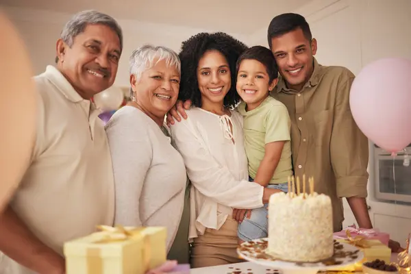 Birthday cake, child and family portrait with grandparents for celebration, party and parents, love and care. Happy interracial people, boy kid and balloon, present or gift and dessert for holiday.