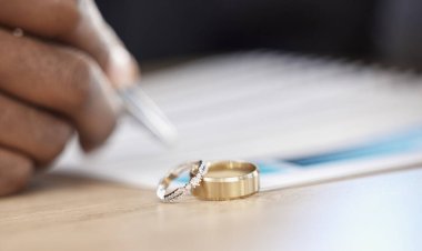 Divorce, rings and signature on paperwork for a lawyer, register wedding or writing on a contract. Table, closeup and a certificate, planning or legal documrnts for a commitment or engagement. clipart