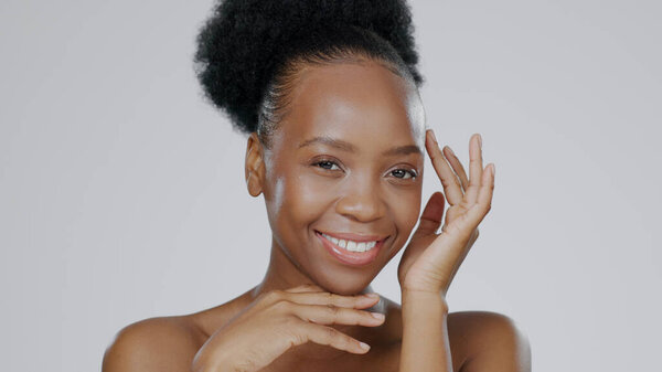 Face, skincare and hands of happy black woman in studio isolated on a gray background for aesthetic. Portrait, touch and natural beauty cosmetics of model in spa facial treatment, wellness and health.