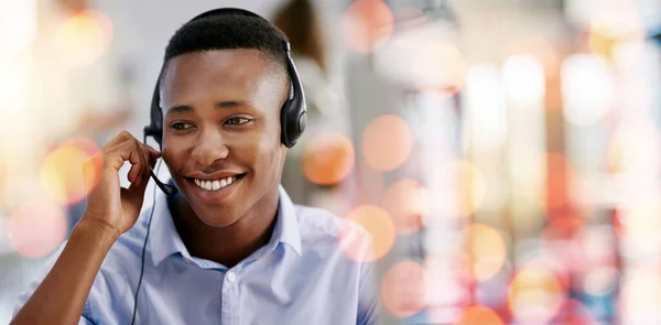 Call center, customer support and man in office with bokeh for crm telemarketing consultation. Mockup space, contact us and professional African male technical support agent with headset in workplace.
