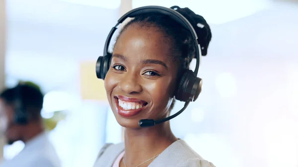 Portrait, call center and happy black woman in telemarketing, support and help desk in office. Customer service, sales agent and face of African consultant, business professional and smile in Nigeria.
