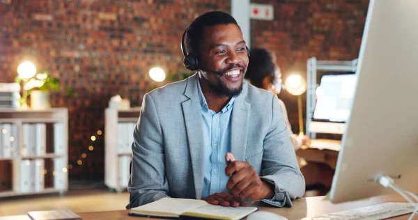 African man, call center and computer in office, talk and night for telemarketing, voip mic and contact us. Consultant, crm and tech support agent for customer service, idea or questions at help desk.
