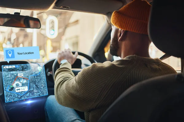 Man, driving and hologram map in car with direction, guide or navigation to location in city with futuristic auto tech. 3d, chart or planning transport or journey with future vehicle technology.