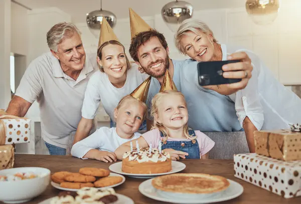 Selfie of parents, grandparents and children with birthday cake for celebration with smile, love and sweets in home. Photography, big family and men, women and kids together for girl party in house