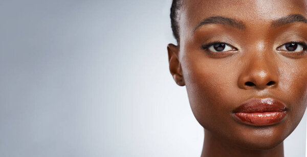 Portrait of black woman, natural beauty or mockup space for wellness in studio with cosmetics or glow. Dermatology, face or confident African girl model with skincare results on white background.