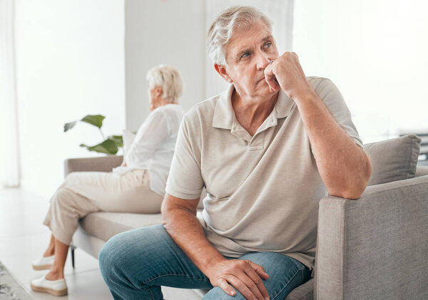 Ignore, elderly couple and divorce on sofa in home living room for conflict, fight or stress for marriage crisis. Senior man, woman and depression, angry at mistake or frustrated at relationship fail.