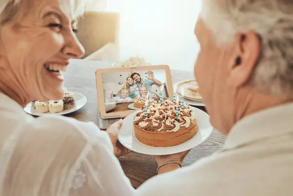 Senior, couple and happy birthday video call in home with cake, family and happiness in celebration. Old people, smile and congratulations for festive day in retirement with love, care and support.