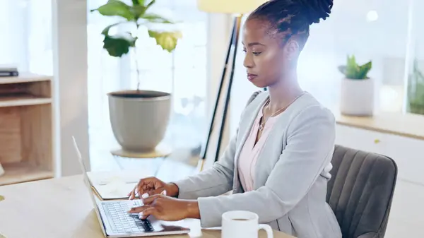 Business, laptop and black woman in office typing, planning or reading project proposal, report or feedback. Planning, research and African female manager online for schedule management or analysis.