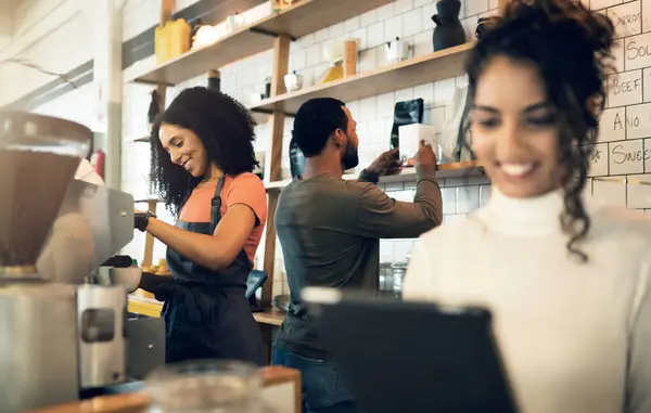 Happy woman, tablet and team in small business at cafe for hospitality service at coffee shop. Female person, entrepreneur or restaurant owner smile with technology and barista in teamwork at store.