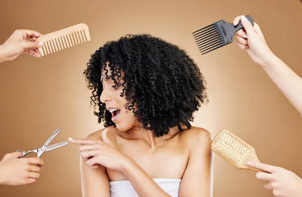 Hair care, shock and tools of woman in a studio with curly, natural and salon treatment. Smile, beauty and model from Mexico with scissor, brush and comb for hairstyle isolated by brown background.