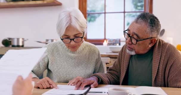 Senior Couple Documents Contract Life Insurance Home Mortgage Discussion Together — Stock Video