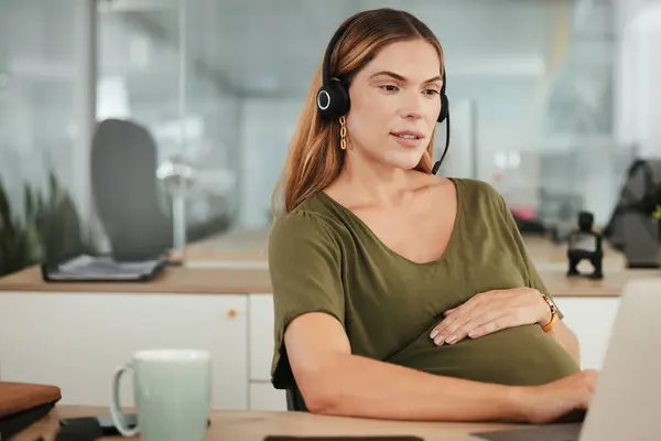 Pregnant, woman and work in call center, office and hands on stomach in telemarketing workplace. Consultant, pregnancy and working in company or planning maternity for health and wellness in business.