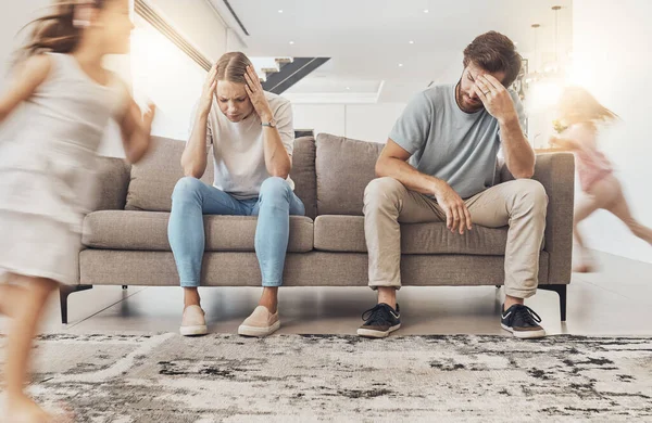 Frustrated Parents Sofa Headache Children Running Living Room Chaos Adhd — Stock Photo, Image