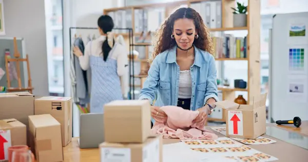Small business, clothes and a woman with order box or logistics for fashion delivery or online store. Young entrepreneur person or startup company owner for e commerce, parcel or packaging of product.
