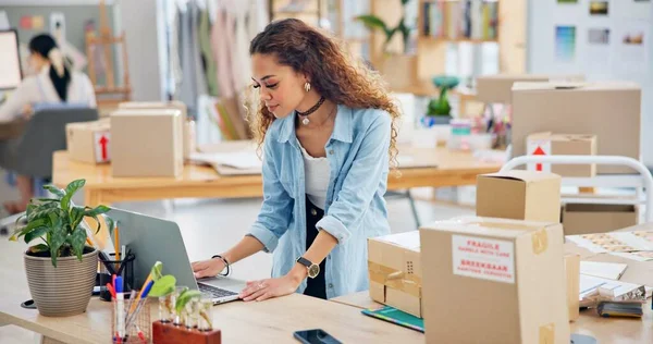 Woman, boxes and laptop for logistics, e commerce and stock management, online shop and stock management. Startup, small business owner or designer with package inventory, computer and website order.