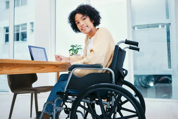 Office, happy and portrait of woman in wheelchair at desk on laptop working on project, report and research. Company, startup and person with disability on computer for internet, email and schedule.