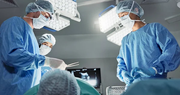 Doctors, team or scissors for surgery in theater with medical support, healthcare or operation at hospital. Surgeon, medicine and teamwork or collaboration with tools for cardiology or emergency help.