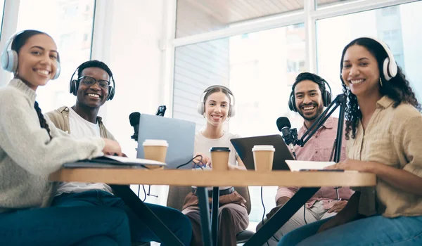 Men, woman and group with microphone, podcast or portrait for chat, creativity or opinion on live stream. Team, laptop and headphones for web talk show, broadcast or smile for collaboration at desk.