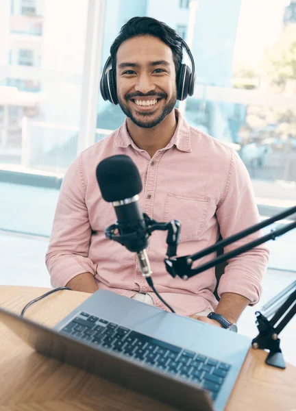 Radio, podcast and portrait of happy asian man in studio live streaming talk show, blog or news announcement with laptop. Recording, face or Japanese guy dj hosting broadcast, speech or entertainment.