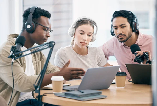 Men, woman and laptop with microphone, podcast or idea for chat, creativity or opinion on live stream. Group, microphone and headphones for web talk show, broadcast or think for collaboration at desk.