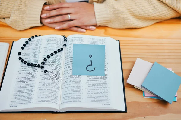 Woman, bible study and question on sticky note, rosary and god for worship, religion and spiritual. Christian, faith and education for christ, believe and respect for scripture, prayer and knowledge.
