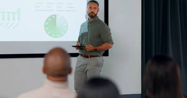 Finance, presentation and a business man coaching a workshop in the conference room of a workplace. Management, meeting and about us with a confident employee talking about our vision in the office.