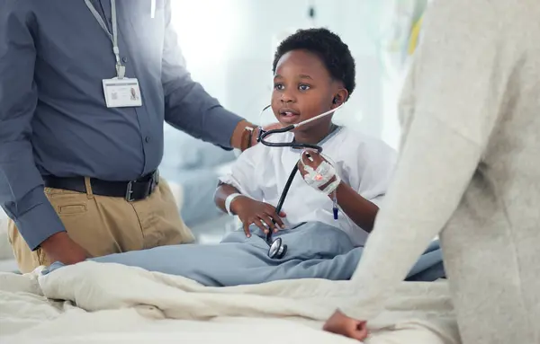 Pediatrician, mother or child with stethoscope to play in hospital for medical exam, game or lungs test. Doctor, monitor or young African boy listening to heart beat with parent or mom for wellness.