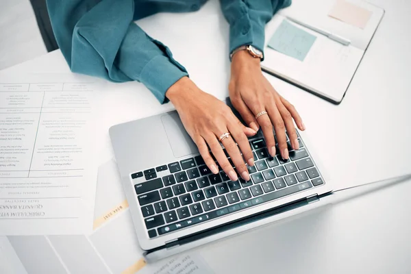 Above, business and hands with typing on laptop, desk and office for career in human resources. Woman, corporate worker and writing on keyboard with pc, technology and internet on cv for job search.